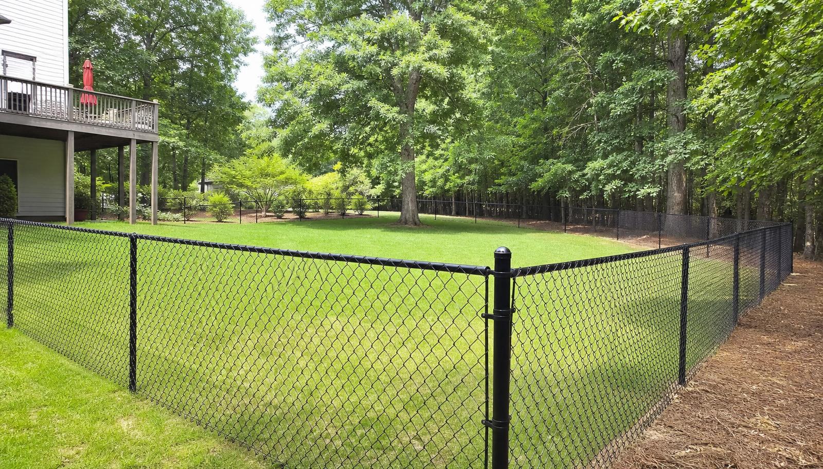 Black vinyl-coated chain link fence installed in Milton, GA